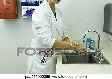 Doctor washing hands View Large Photo Image Stock Photo - Doctor washing hands. Fotosearch