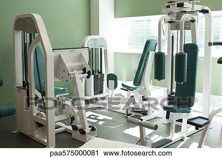 Fitness equipment in gym room View Large Photo Image Stock Image - Fitness equipment in gym room. Fotosearch