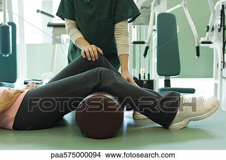 Patient receiving physical therapy treatment View Large Photo Image Picture - Patient receiving physical therapy treatment. Fotosearch