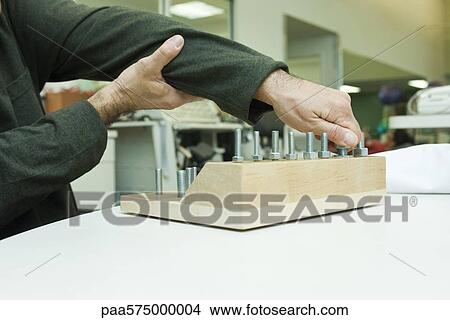 Using therapeutic tool for improving fine motor and sensory function View Large Photo Image Picture - Using therapeutic tool for improving fine motor and sensory function. Fotosearch