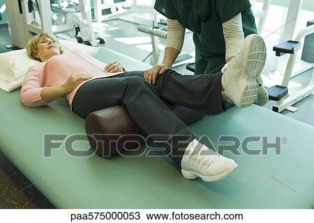 Woman being treated by physical therapist View Large Photo Image Stock Image - Woman being treated by physical therapist. Fotosearch