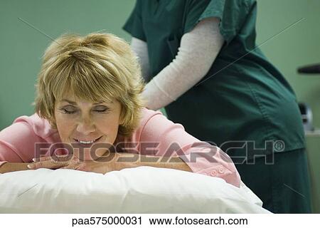 Woman enjoying back massage View Large Photo Image Stock Image - Woman enjoying back massage. Fotosearch