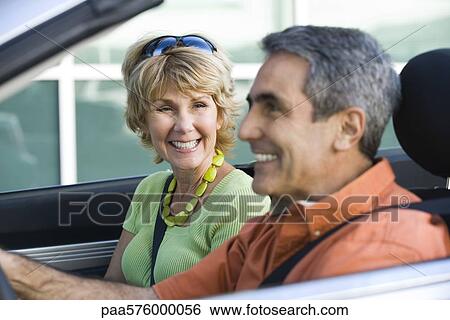 Mature couple out for pleasure drive View Large Photo Image Stock Photograph - Mature couple out for pleasure drive. Fotosearch