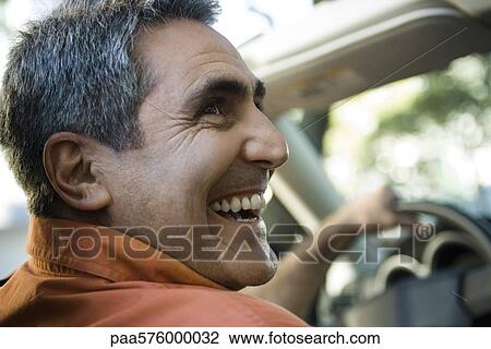 Mature man driving with look of happiness View Large Photo Image Stock Image - Mature man driving with look of happiness. Fotosearch