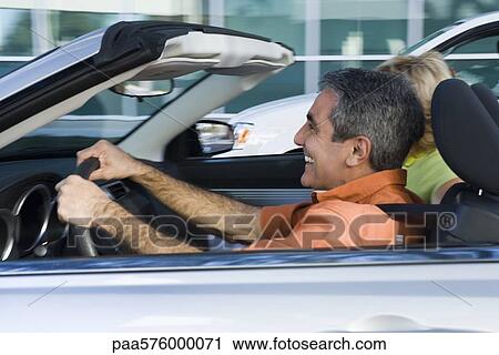 Mature man enjoying driving convertible View Large Photo Image Stock Image - Mature man enjoying driving convertible. Fotosearch