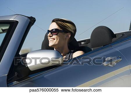 Woman driving convertible View Large Photo Image Stock Photography - Woman driving convertible. Fotosearch