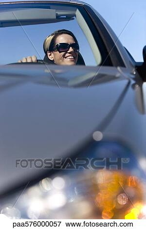 Woman enjoying drive on sunny day View Large Photo Image Stock Photo - Woman enjoying drive on sunny day. Fotosearch