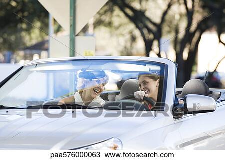 Woman out with friend for pleasure drive View Large Photo Image Stock Image - Woman out with friend for pleasure drive. Fotosearch