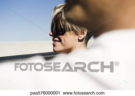Stock Image - Woman riding in car. Fotosearch