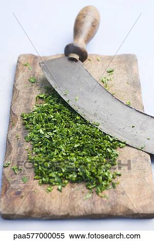 Freshly chopped herbs on cutting board View Large Photo Image Stock Photography - Freshly chopped herbs on cutting board. Fotosearch