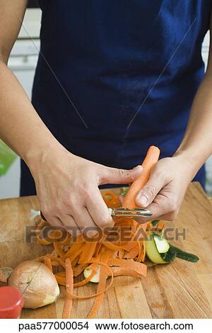 Peeling vegetables View Large Photo Image Picture - Peeling vegetables. Fotosearch