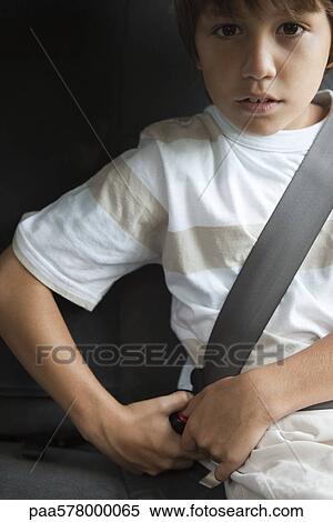 Boy fastening car seat belt View Large Photo Image Stock Photography - Boy fastening car seat belt. Fotosearch