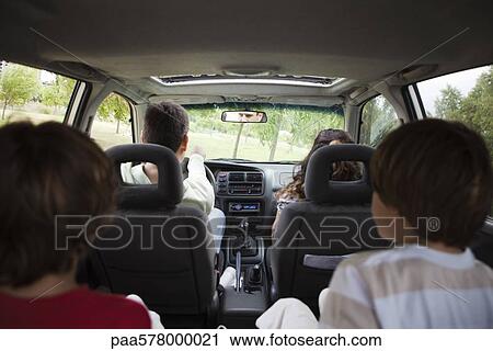 Stock Image - Family riding together in car. Fotosearch
