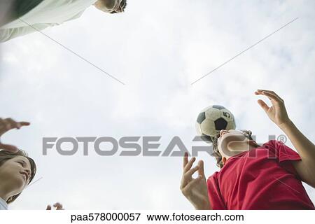 Father and sons playing soccer, low angle view View Large Photo Image Stock Photo - Father and sons playing soccer, low angle view. Fotosearch