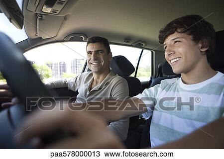 Father teaching his son to drive View Large Photo Image Stock Image - Father teaching his son to drive. Fotosearch