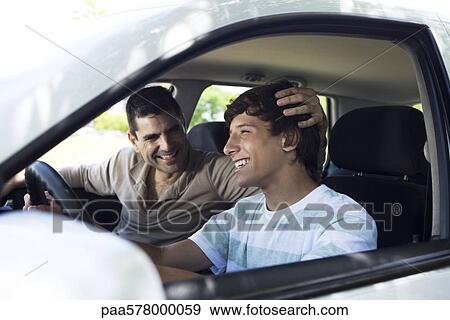Father teaching his son to drive View Large Photo Image Stock Photo - Father teaching his son to drive. Fotosearch