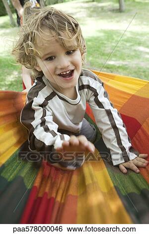 Little boy having fun outdoors, portrait View Large Photo Image Stock Photograph - Little boy having fun outdoors, portrait. Fotosearch