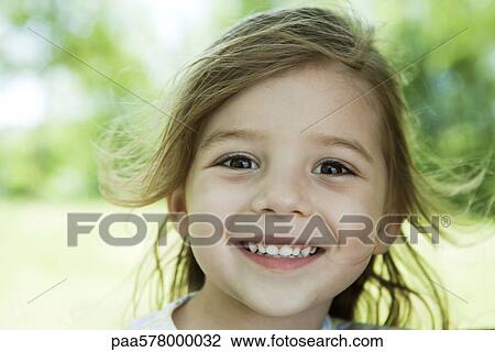 Little girl outdoors, portrait View Large Photo Image Stock Image - Little girl outdoors, portrait. Fotosearch