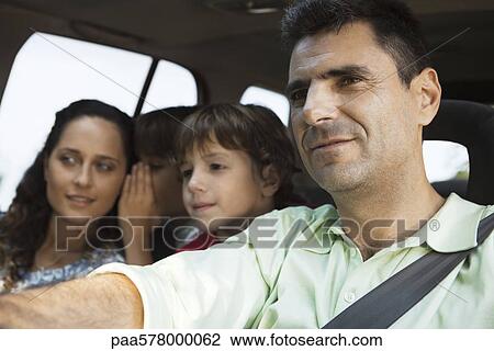 Man driving with his family View Large Photo Image Stock Image - Man driving with his family. Fotosearch