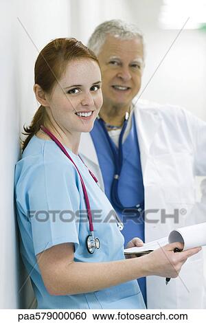 Doctor and nurse smiling, portrait View Large Photo Image Stock Image - Doctor and nurse smiling, portrait. Fotosearch