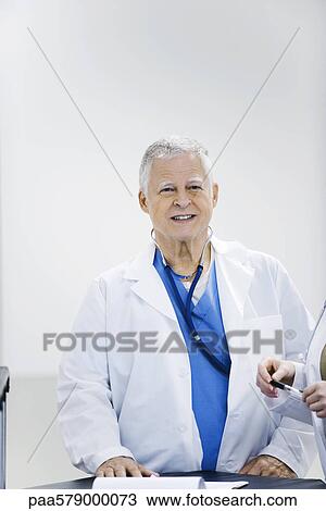 Doctor smiling, portrait View Large Photo Image Stock Image - Doctor smiling, portrait. Fotosearch