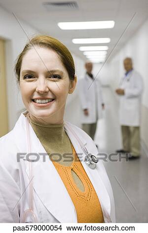 Female doctor smiling, portrait View Large Photo Image Picture - Female doctor smiling, portrait. Fotosearch