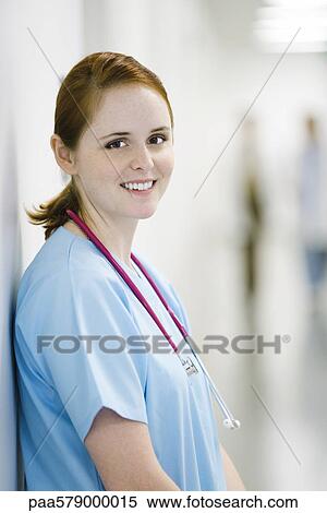 Nurse leaning against wall, portrait View Large Photo Image Stock Photography - Nurse leaning against wall, portrait. Fotosearch
