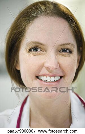Nurse smiling, headshot View Large Photo Image Stock Photo - Nurse smiling, headshot. Fotosearch