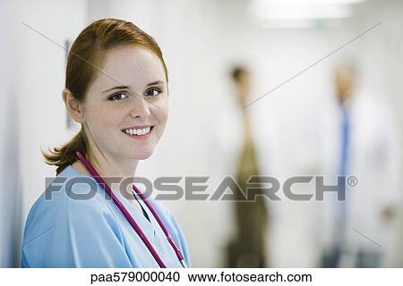 Nurse smiling, portrait View Large Photo Image Stock Image - Nurse smiling, portrait. Fotosearch