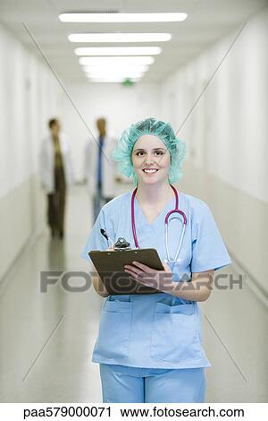 Nurse wearing surgical cap, portrait View Large Photo Image Stock Image - Nurse wearing surgical cap, portrait. Fotosearch