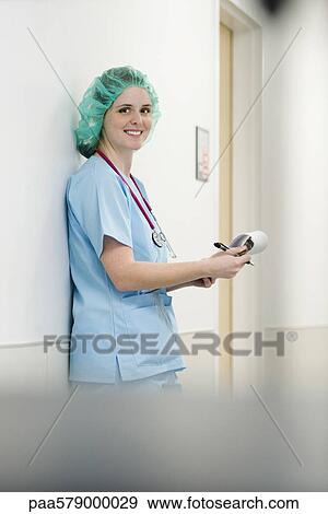 Nurse wearing surgical cap, portrait View Large Photo Image Stock Photo - Nurse wearing surgical cap, portrait. Fotosearch