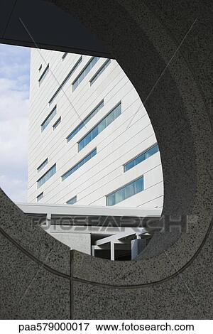 View of skyscraper through window in wall View Large Photo Image Stock Photo - View of skyscraper through window in wall. Fotosearch