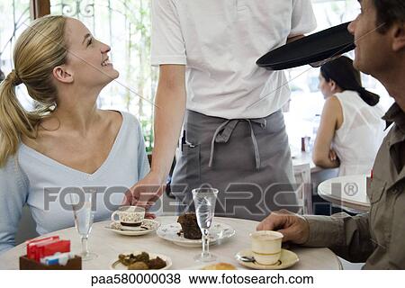 Stock Photo - Couple having coffee in cafe. Fotosearch