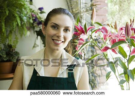 Stock Image - Female florist, portrait. Fotosearch