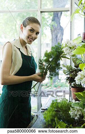 Stock Photograph - Female florist, portrait. Fotosearch