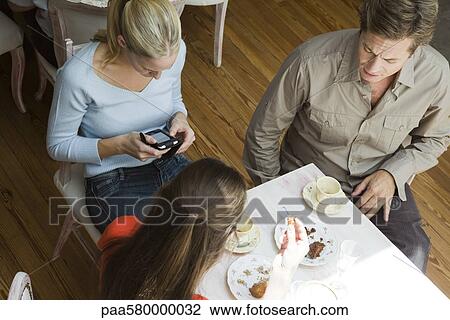 Stock Image - Friends at cafe. Fotosearch
