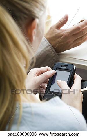 Woman using cell phone View Large Photo Image Stock Image - Woman using cell phone. Fotosearch