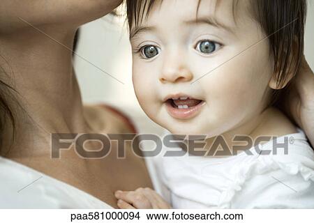 Baby girl in mother's arms, portrait View Large Photo Image Picture - Baby girl in mother's arms, portrait. Fotosearch