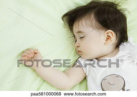 Baby girl sleeping View Large Photo Image Stock Photo - Baby girl sleeping. Fotosearch