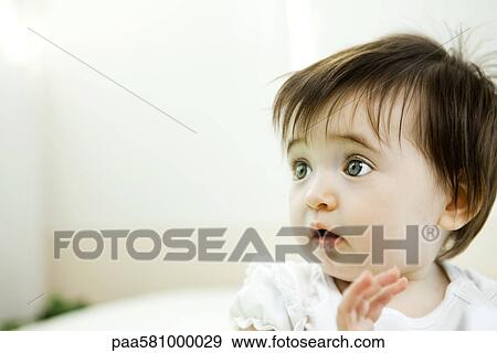 Baby girl with startled expression, portrait View Large Photo Image Stock Photo - Baby girl with startled expression, portrait. Fotosearch