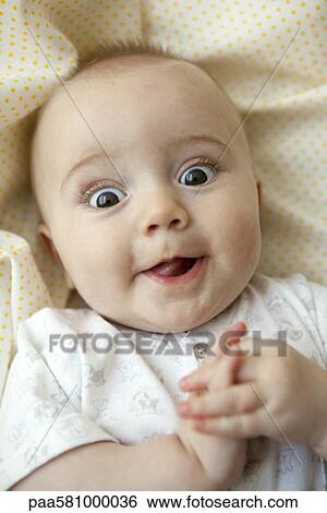 Baby looking at camera with wide eyes, portrait View Large Photo Image Stock Photograph - Baby looking at camera with wide eyes, portrait. Fotosearch