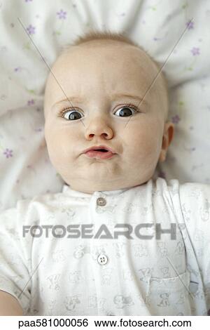 Baby making faces at camera, portrait View Large Photo Image Stock Photograph - Baby making faces at camera, portrait. Fotosearch