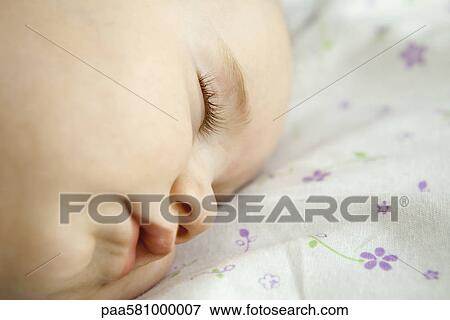 Stock Photo - Baby sleeping, close-up. Fotosearch