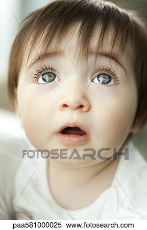 Stock Photography - Infant looking up, portrait. Fotosearch
