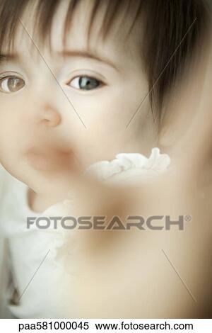 Infant reaching toward camera, close-up View Large Photo Image Stock Photography - Infant reaching toward camera, close-up. Fotosearch