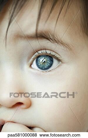 Stock Photo - Infant's eye, close-up. Fotosearch