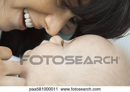 Mother nuzzling baby View Large Photo Image Stock Image - Mother nuzzling baby. Fotosearch