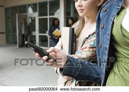 Picture - Cell phones make communication simple even when on the move. Fotosearch