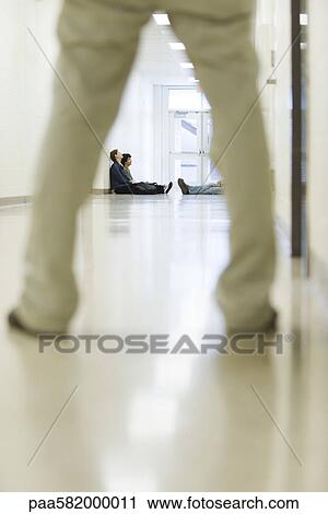 High school administrator catching students hanging out in the school corridor View Large Photo Image Stock Image - High school administrator catching students hanging out in the school corridor. Fotosearch