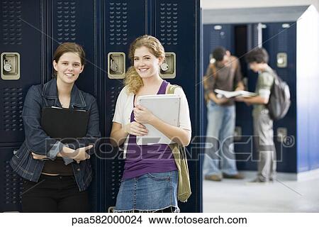 High school friends together by lockers, portrait View Large Photo Image Picture - High school friends together by lockers, portrait. Fotosearch